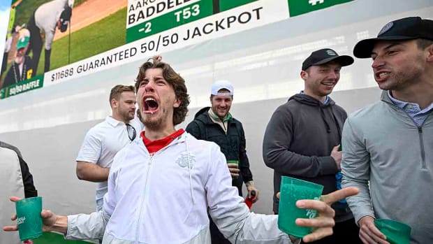 Fans celebrate off the 16th green during the continuation of the second round of the WM Phoenix Open at TPC Scottsdale on Saturday, Feb. 10, 2024.